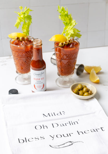 Extra Hissy Fit Hot sauce in Bloody Marys with a towel that says Mild? Oh Darlin' bless your heart.
