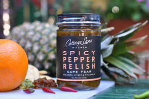 Cape Fear Spicy Pepper Relish 12oz bottle with fruit display