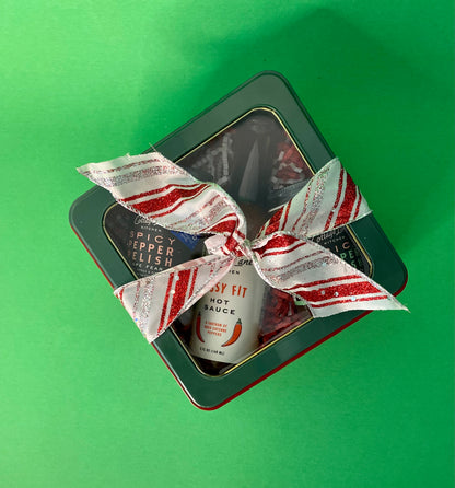 Clear Top gift box with Cottage Lane Kitchen products inside and wrapped with a red and white ribbon